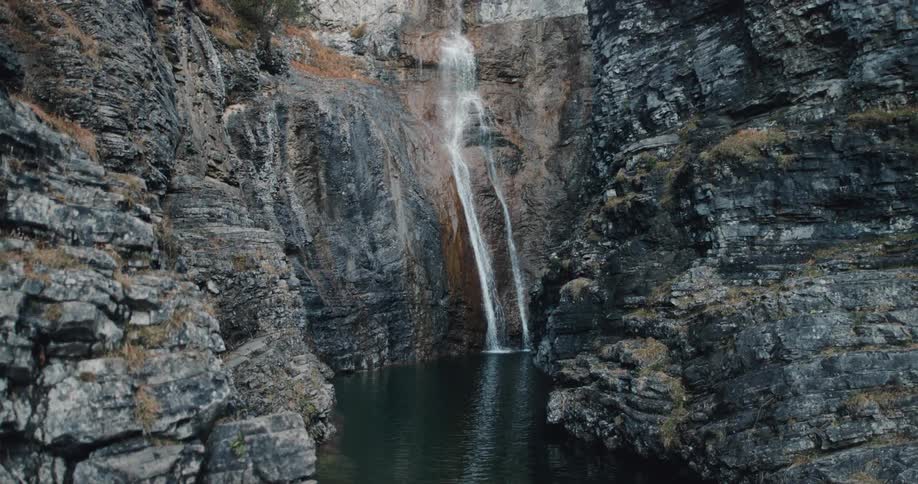 A waterfall running down a cliff