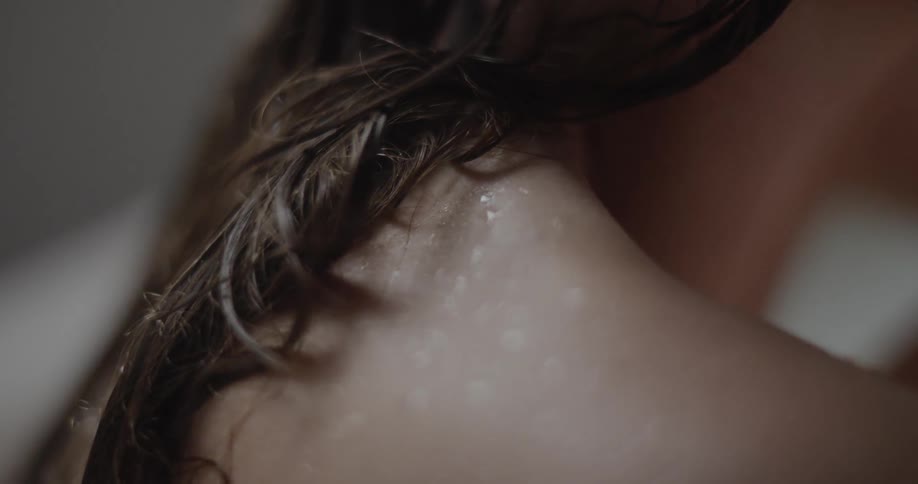 A woman has wet skin