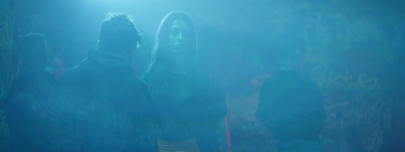 A group of teens dance outside