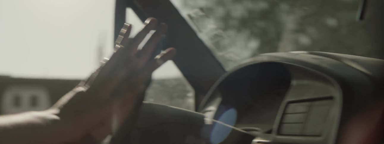 A man drives in a car
