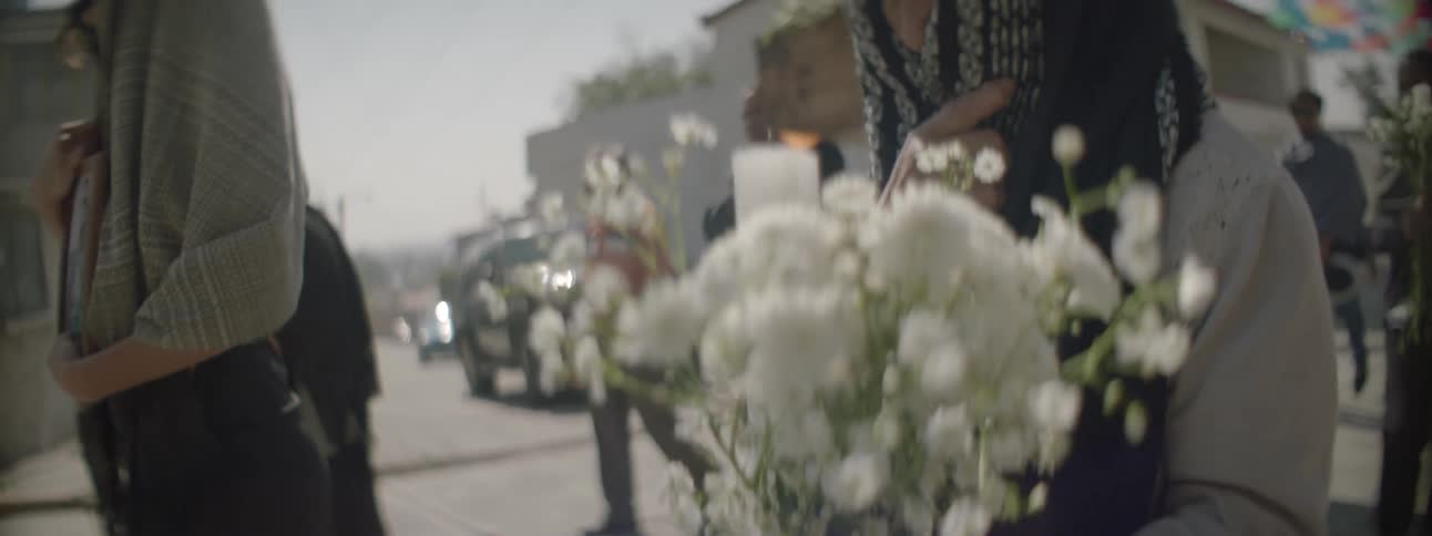 Many walk with flowers