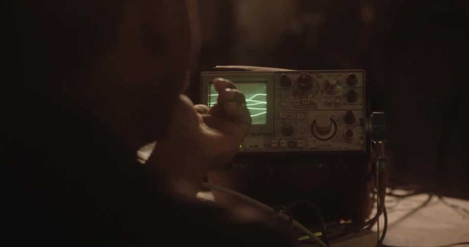 A person points at a device