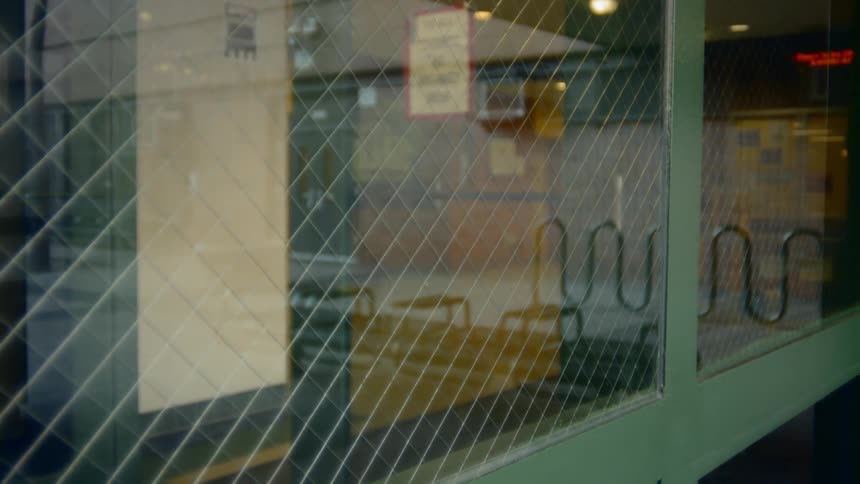 Light reflects off panes of security glass