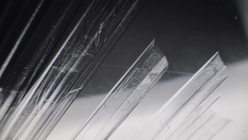 Crystalline structures forming inside a clear liquid