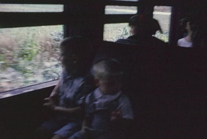 Families take a train ride and eat a snack