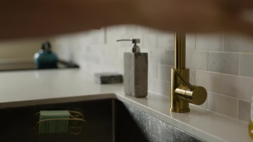 A person using a paper towel to dry their hands