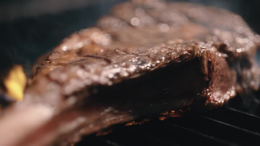 A piece of meat being grilled