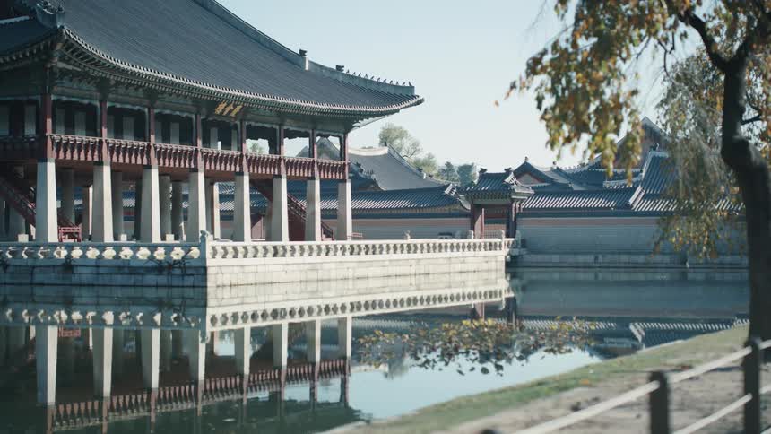 A building with old asian architecture on a body of water