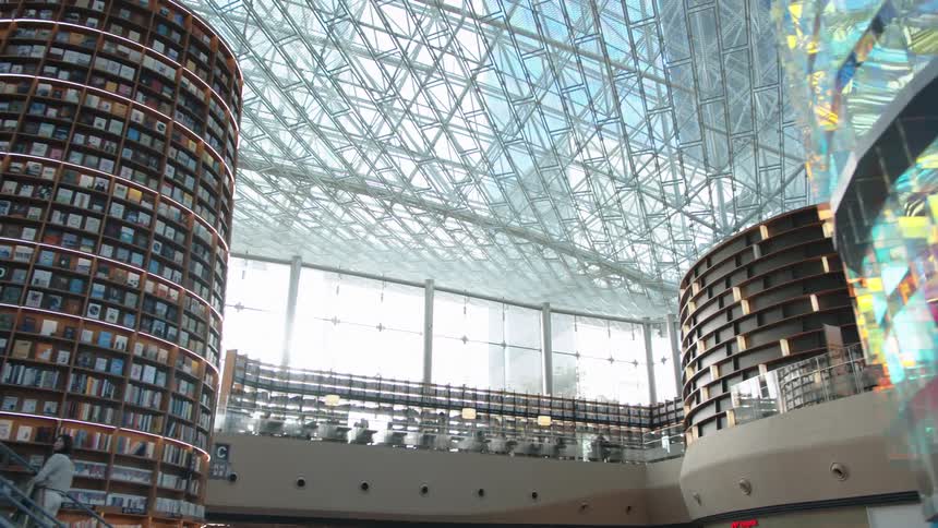 The inside of a large building with a glass facade