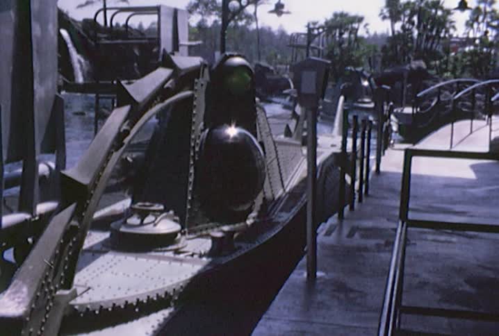 An amusement park submarine ride around the pond