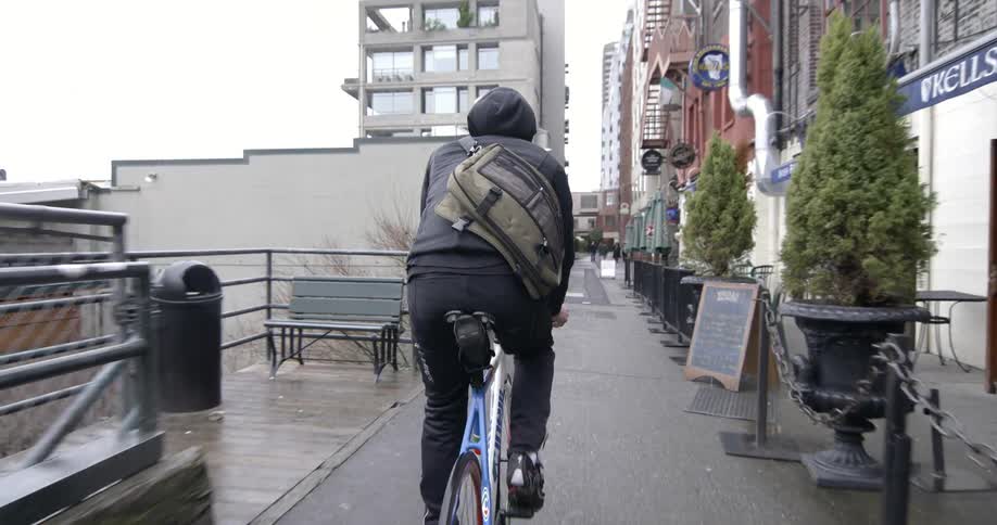 A person bikes in a city