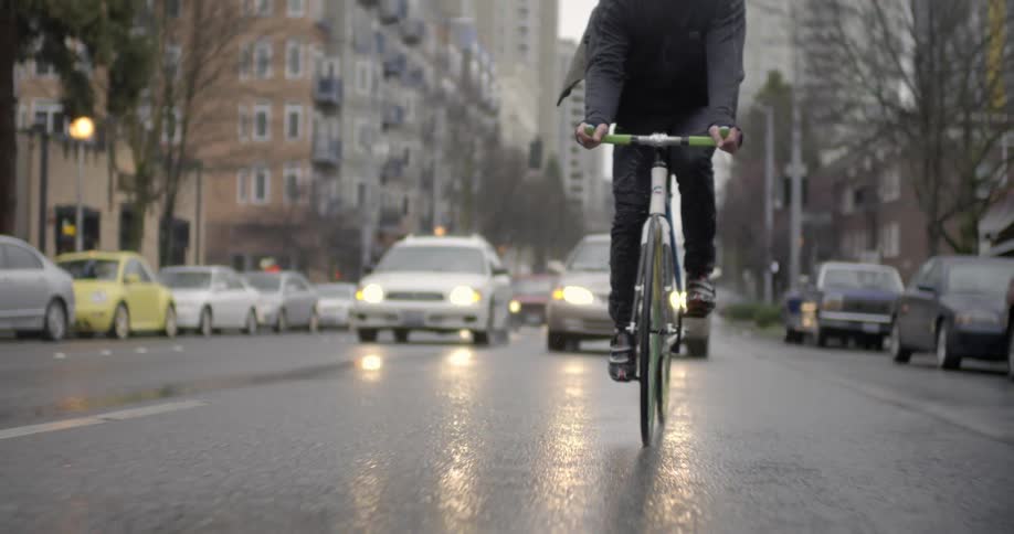 Person riding bike in the rain