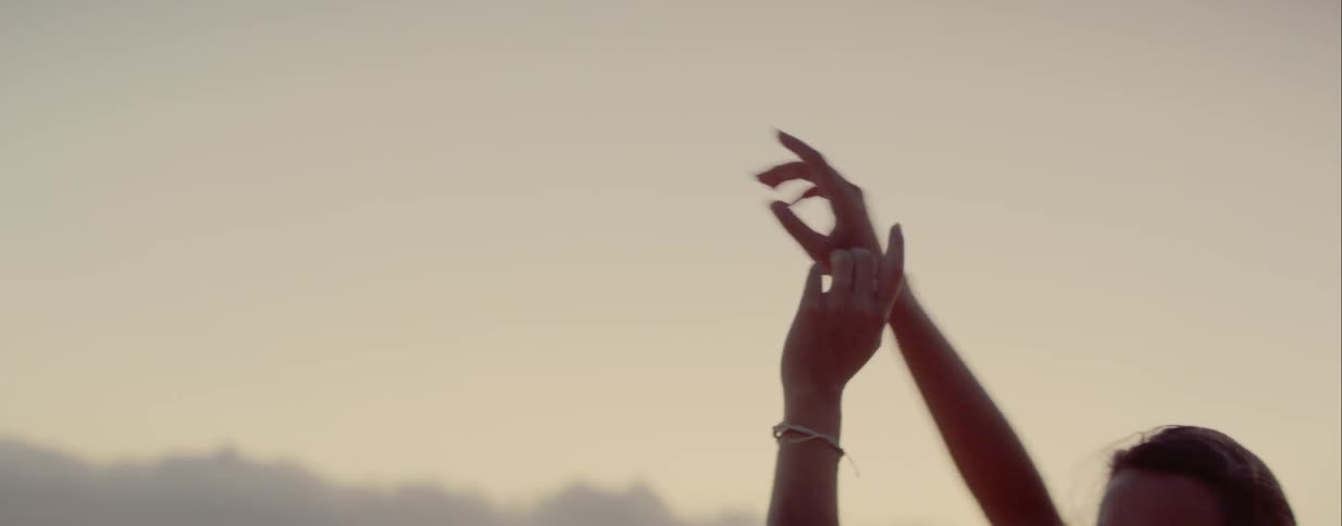 A woman dances outside