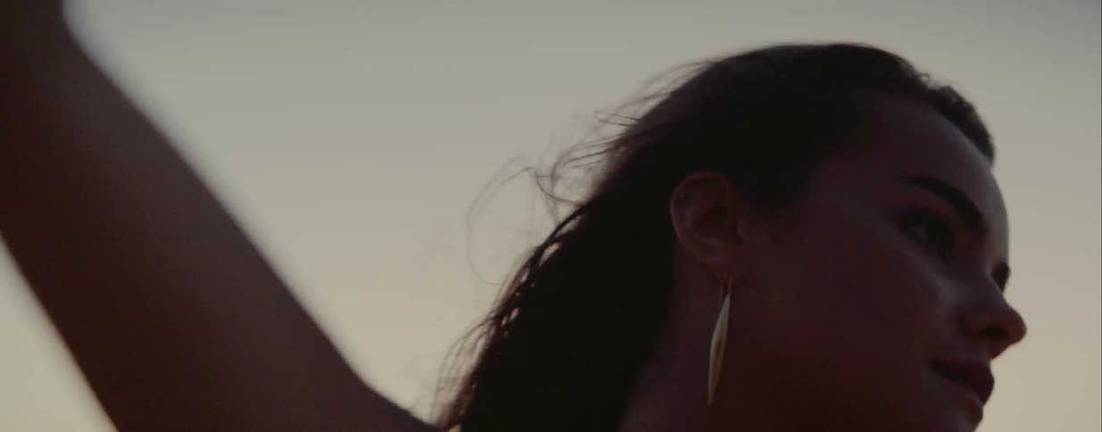 A teenager dances outside