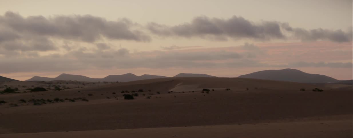 Panoramic view of hills at sunset
