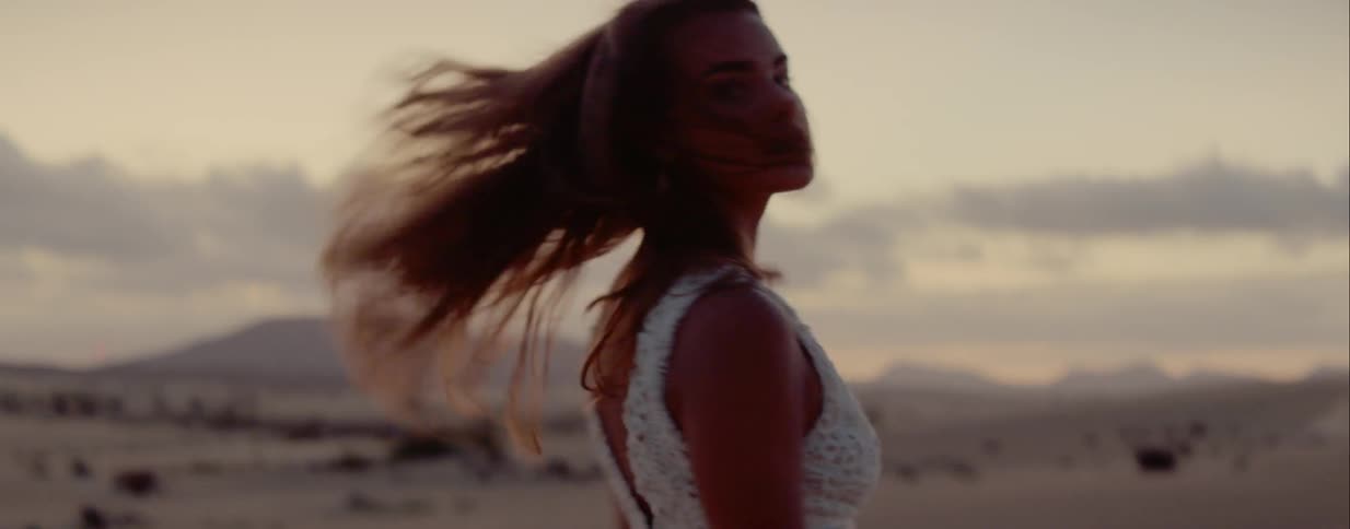 A woman dances outside