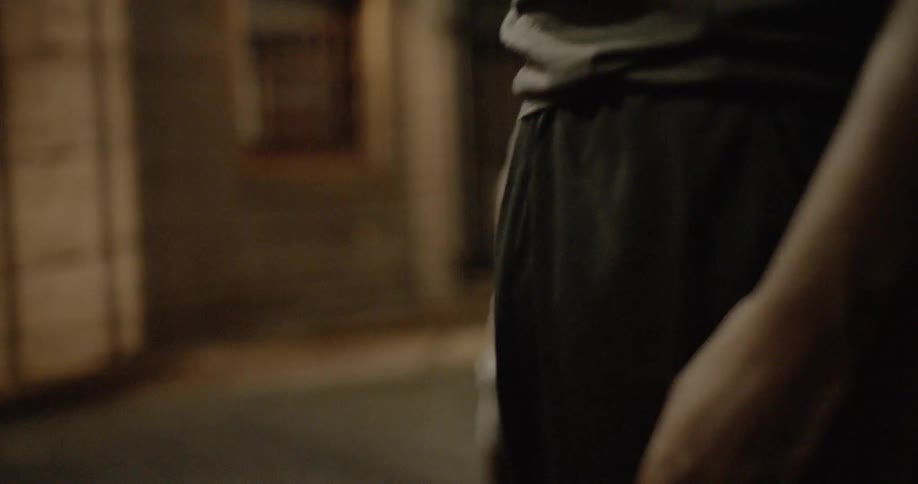 A man is standing outside laughing