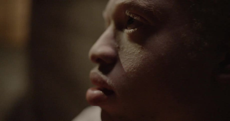 Close up of man face under white light