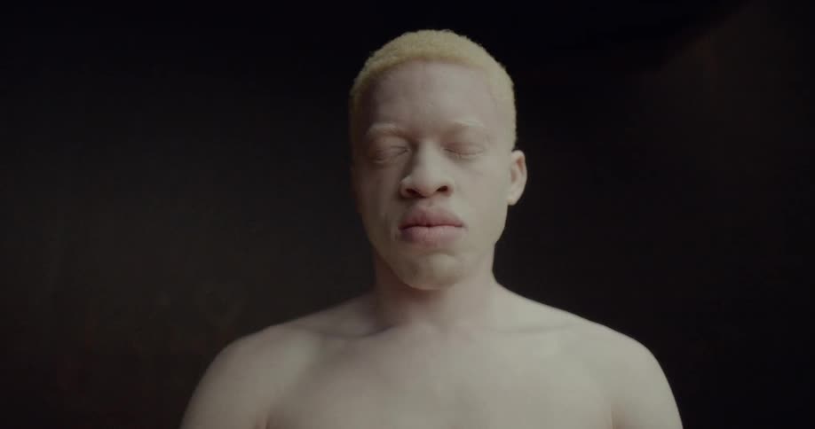 A man moves his head back and forth