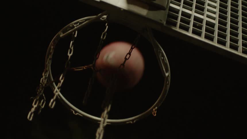 A basketball bounces off of a basketball hoop
