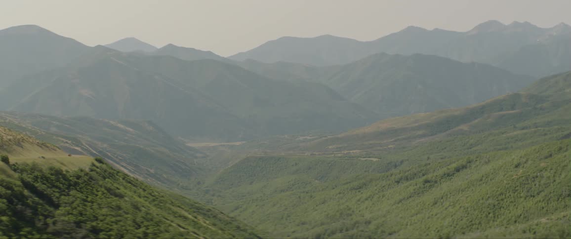 The hills are covered with fog