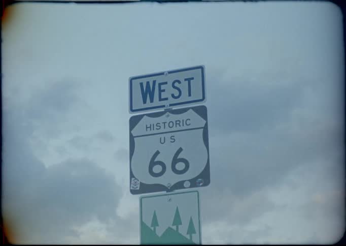 A sign beneath the clouds