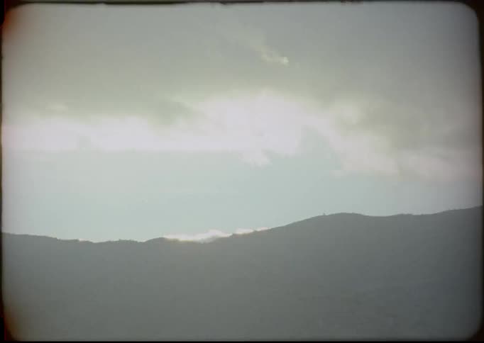 Clouds float above a mountain range