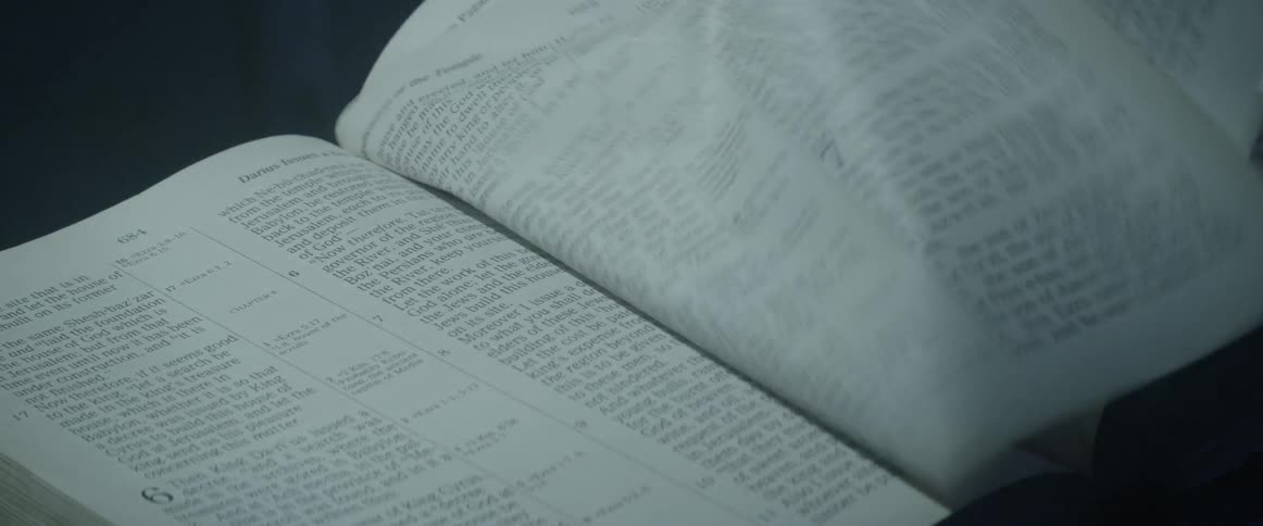 Pages of a bible flip quickly without a hand moving them