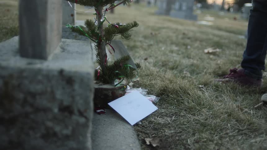 A person sets down an envelope