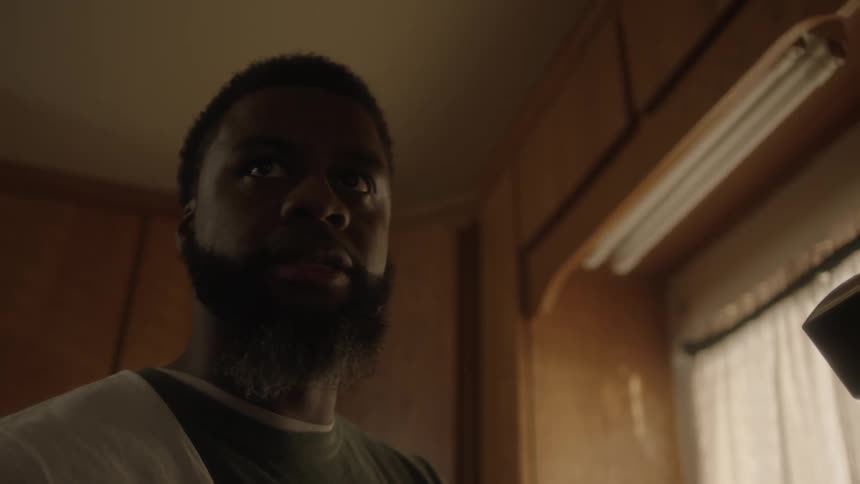 A man standing in a room looking around