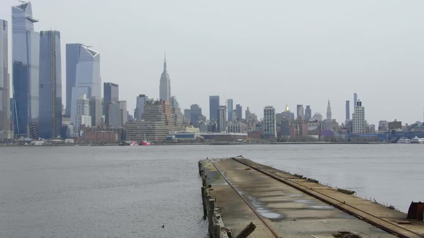 A pier with the city skyline in the background