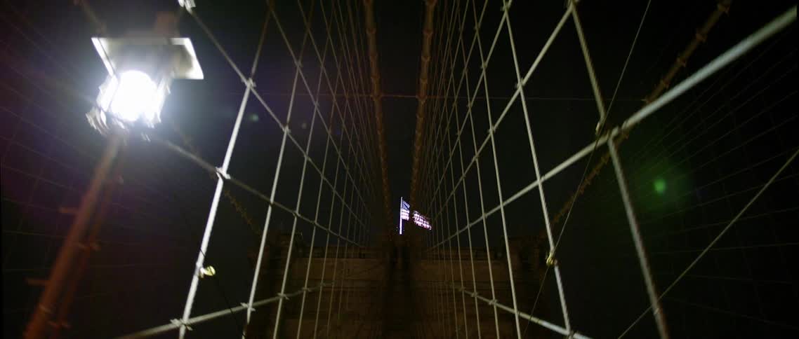 A flag at the end of a bridge