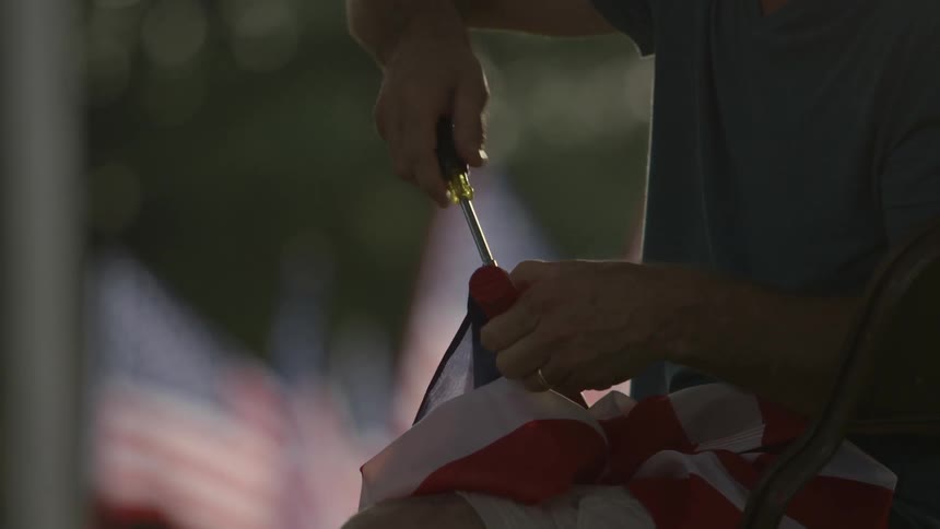 A man uses a screwdriver