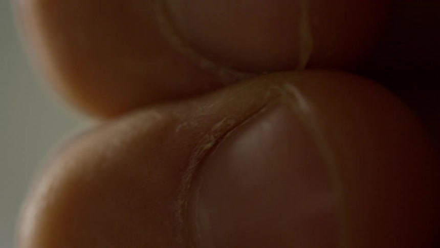Finger pressed against a persons skin