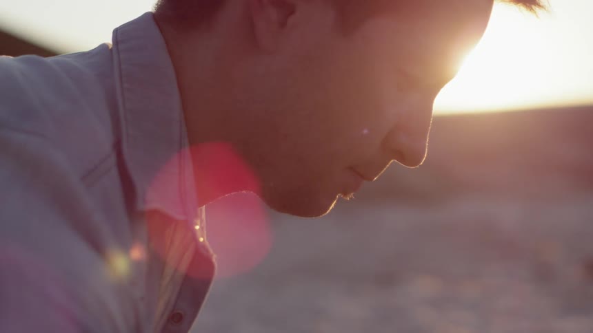 A man looks down towards the ground