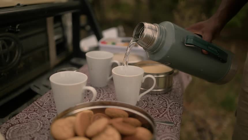 Pouring water into a mug
