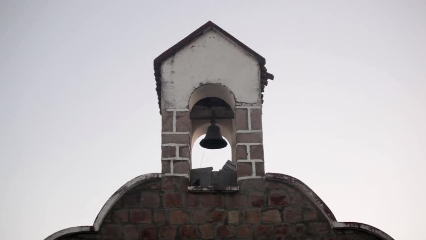View of a bell tower on a cloudy day