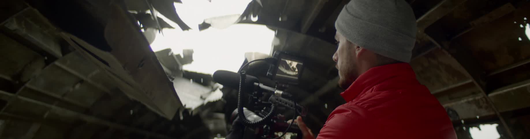 A man is recording inside a crashed plane