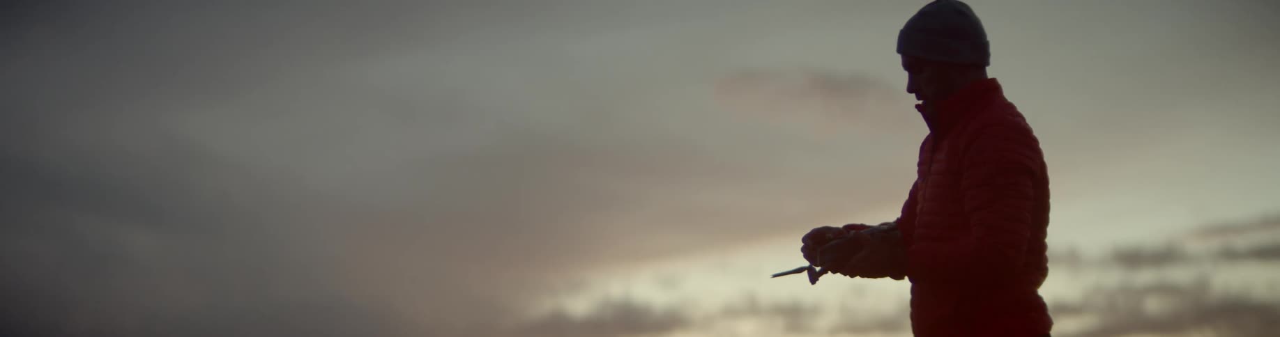 A man lifts up his drone