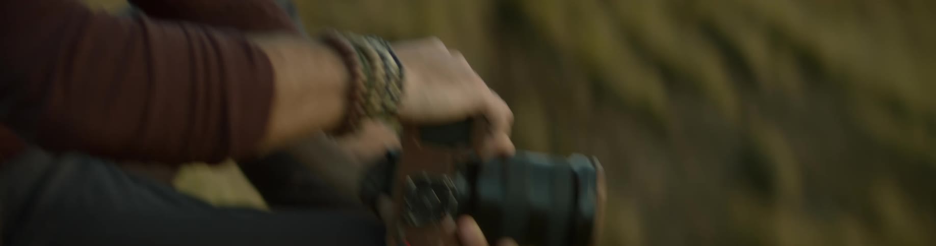 A white man takes photos in nature