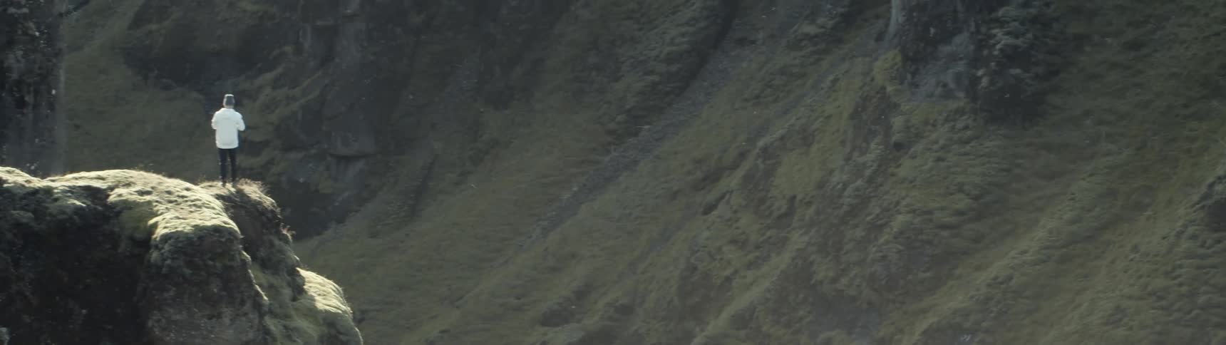 Panoramic view of man standing on mountain top