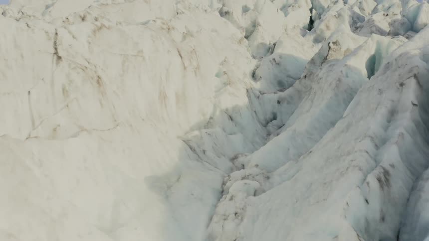 Cracks split the surface of a glacier