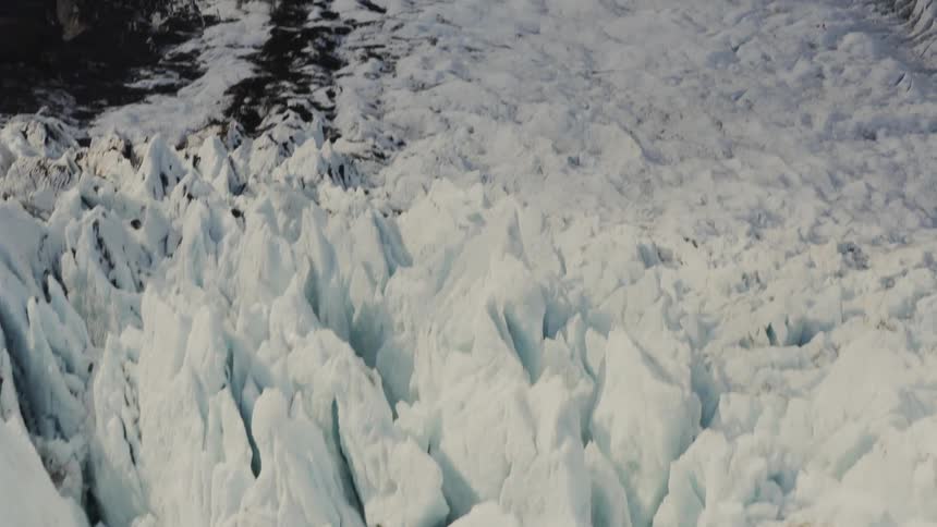 Jagged terrain covered in ice and snow