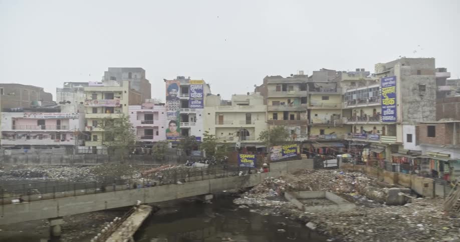 View of Trash Polluting River in Urban India