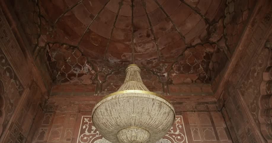 An ornate chandelier hanging in Jama Masjid Mosque of Delhi