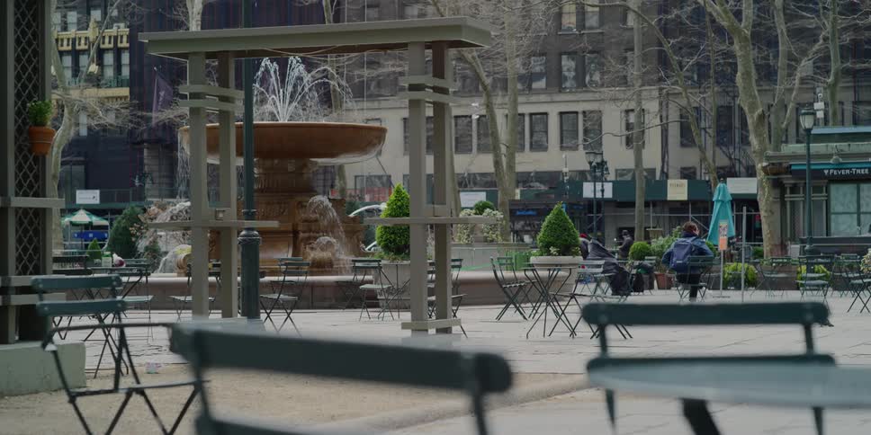 Empty park with fountain in city downtown at day
