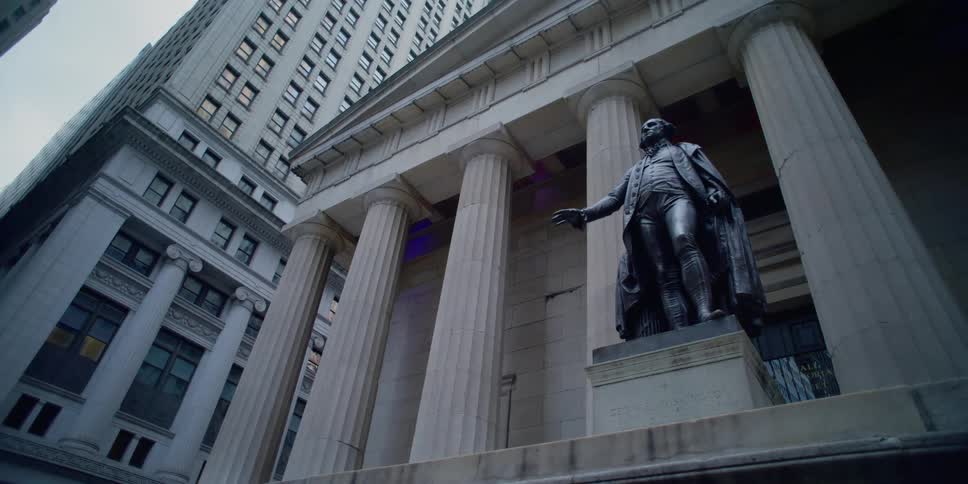 Bronze sculpture of george washington on the front steps of federal hall national memorial on wall street in new york
