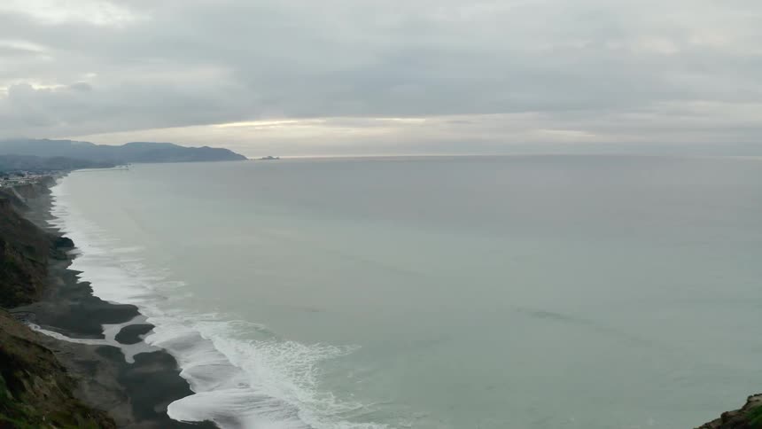 A large cliff overlooking a rocky coast
