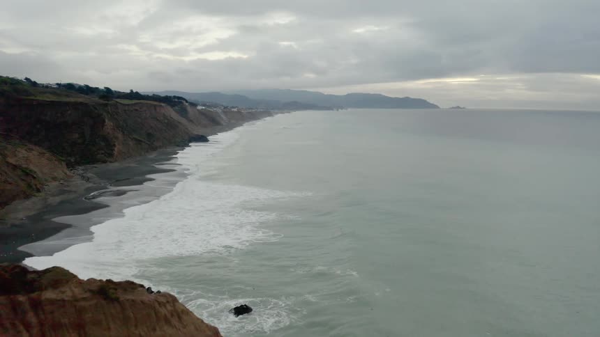 Waves roll in towards the shoreline