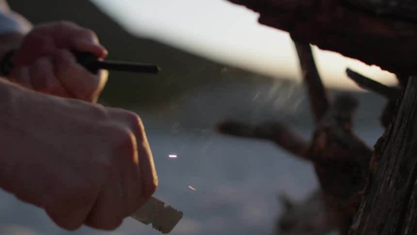 Man creates sparks while trying to light a fire
